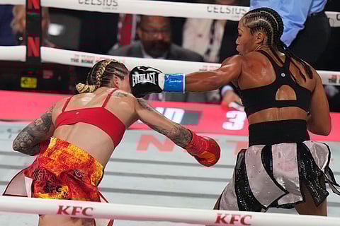 Lela Beaudoin, left, and Alycia Baumgardner, right, compete during their super-featherweight fight in Miami.