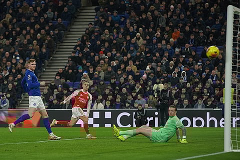 Arsenal's Leandro Trossard, center, hits the right post during the English Premier League soccer match between Everton and Arsenal in Liverpool, England.