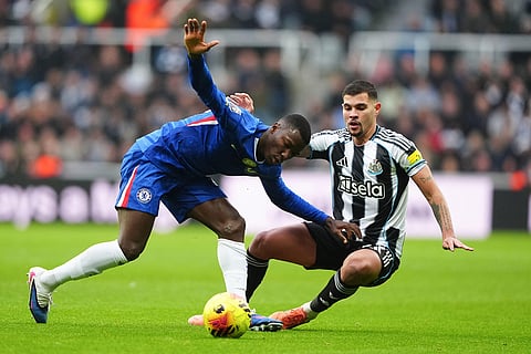 Newcastle's Bruno Guimaraes, right, and Chelsea's Moises Caicedo, left, challenge for the ball during the English Premier League soccer match between Newcastle United and FC Chelsea in Newcastle, England.