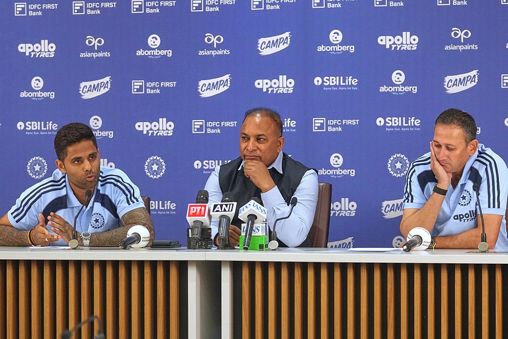 Indian Mens T20 Captain Suryakumar Yadav, left, speaks as Board of Control for Cricket in India (BCCI) Secretary Devajit Saikia , centre, and Chief Selector Ajit Agarkar look on during a press conference for India's squad announcement for the ICC Men's T20 World Cup 2026 at BCCI headquarter in Mumbai. - | Photo: AP/Rafiq Maqbool
