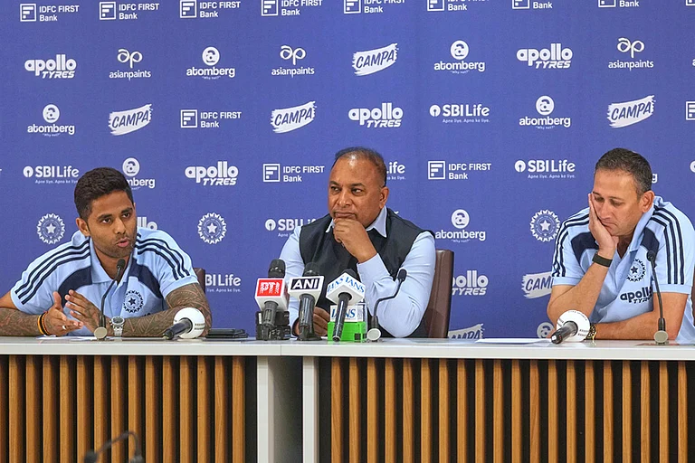 Indian Mens T20 Captain Suryakumar Yadav, left, speaks as Board of Control for Cricket in India (BCCI) Secretary Devajit Saikia , centre, and Chief Selector Ajit Agarkar look on during a press conference for India's squad announcement for the ICC Men's T20 World Cup 2026 at BCCI headquarter in Mumbai. - | Photo: AP/Rafiq Maqbool