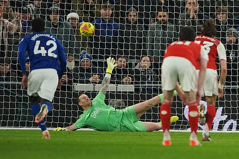 Everton's goalkeeper Jordan Pickford, center, fails to save a penalty kicked by Arsenal's Viktor Gyoekeres during the English Premier League soccer match between Everton and Arsenal in Liverpool, England.