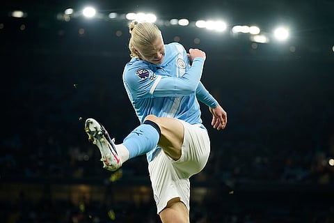 Manchester City's Erling Haaland reacts after missing a chance to score a goal during the English Premier League soccer match between Manchester City and West Ham United in Manchester, England.