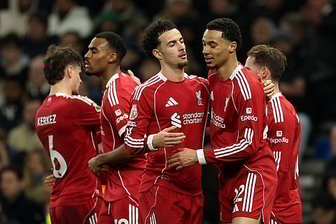 Liverpool's Hugo Ekitike, front right, celebrates with teammates after scoring his side's second goal during the English Premier League soccer match between Tottenham and Liverpool in London.