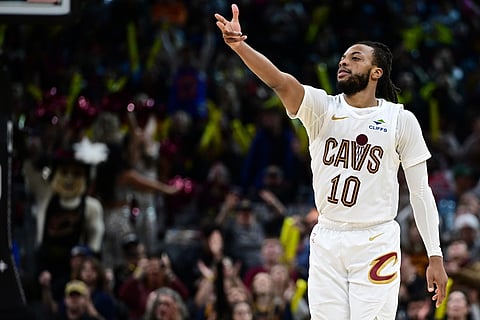 Cleveland Cavaliers guard Darius Garland celebrates after a 3-point basket in the second half of an NBA basketball game against the Chicago Bulls, in Cleveland. 