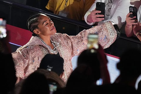 Alycia Baumgardner walks to the ring before her super-featherweight fight against Lela Beaudoin in Miami.