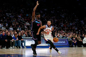 | Photo: AP/John Munson : New York Knicks guard Jalen Brunson (11) dribbles around Miami Heat center Bam Adubayo (13) during the first half of an NBA basketball game in New York.