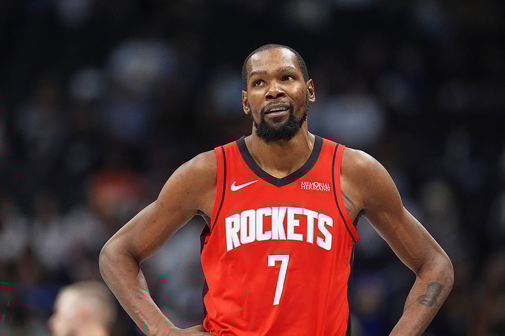 Houston Rockets forward Kevin Durant heads to the bench late in an NBA basketball game against the Denver Nuggets in Denver.  - | Photo: AP/David Zalubowski