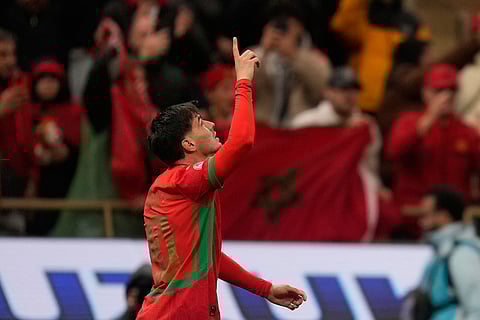 Morocco's Brahim Abdelkader Díaz celebrates after scoring during the Africa Cup of Nations group A soccer match between Morocco and Comoros in Rabat, Morocco.