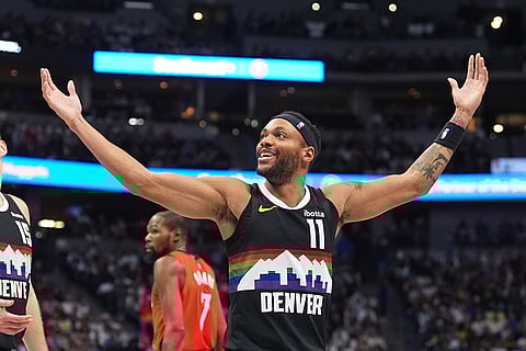 Denver Nuggets guard Bruce Brown reacts after being called for a foul in the second half of an NBA basketball game against the Houston Rockets in Denver. 