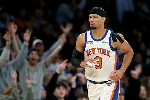 New York Knicks guard Josh Hart reacts after hitting a 3-point basket during the second half of an NBA basketball game against the Miami Heat, in New York. 