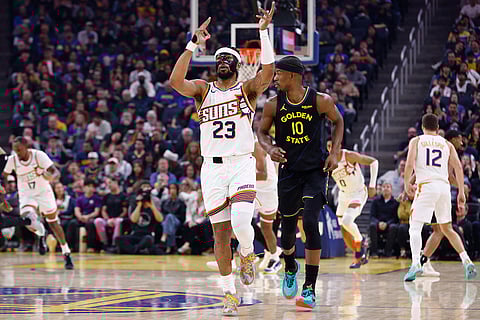 Phoenix Suns guard Jordan Goodwin (23) celebrates his three-pointer against the Golden State Warriors in the first half during an NBA basketball game in San Francisco.
