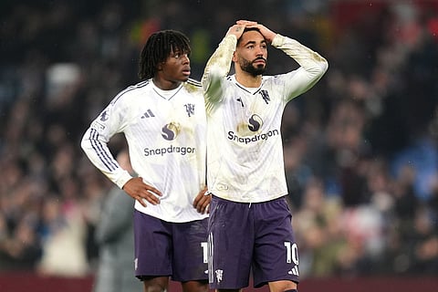 Manchester United's Matheus Cunha, right, looks dejected after the Premier League soccer match between Aston Villa and Manchester United, in Birmingham, England.