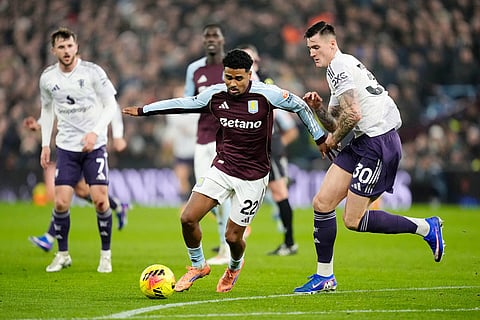 Aston Villa's Ian Maatsen and Manchester United's Benjamin Sesko, right, battle for the ball during the Premier League soccer match between Aston Villa and Manchester United, in Birmingham, England.