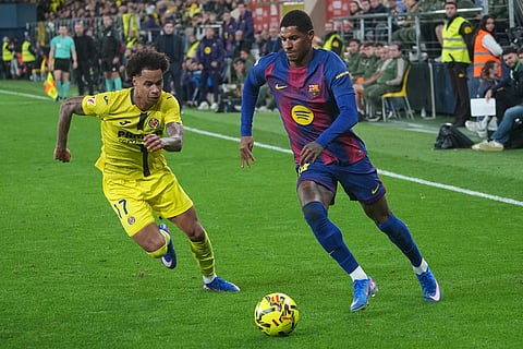 Barcelona's Marcus Rashford, right, duels for the balls with Villarreal's Tajon Buchanan during the Spanish La Liga soccer match between Villarreal and Barcelona in Villarreal, Spain.