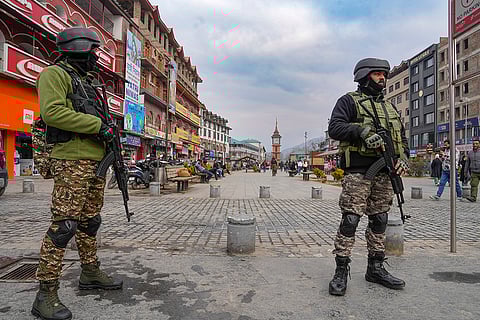 Security personnel stand guard amid heightened security ahead of the Christmas festival celebrations, at Lal Chowk in Srinagar.