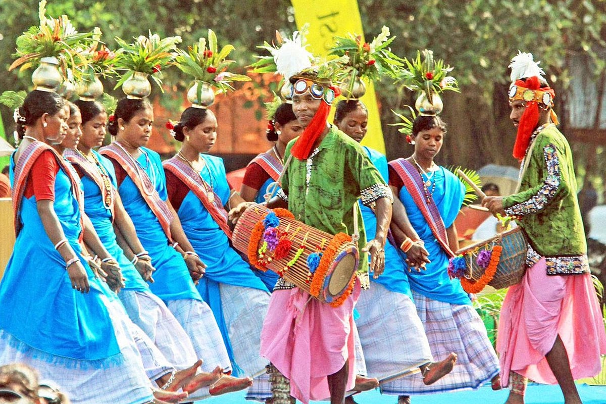 Folk dancers in traditional attire performing Sarhul dance