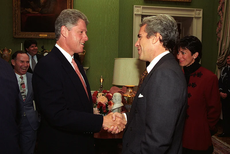 Former US President Bill Clinton with Jeffrey Epstein.j