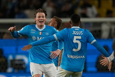 Napoli's Scott McTominay celebrates with teammate Napoli's Juan Jesus at the end of the Italian Super Cup final soccer match between Napoli and Bologna in Riyadh, Saudi Arabia.