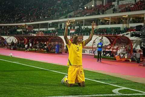 Zimbabwe's Prince Dube celebrates after scoring during the Africa Cup of Nations group B soccer match between Egypt and Zimbabwe in Agadir, Morocco.