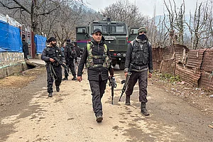 | Photo: PTI : Security officials keep vigil during a search and cordon operation, in Salia village of Anantnag district.