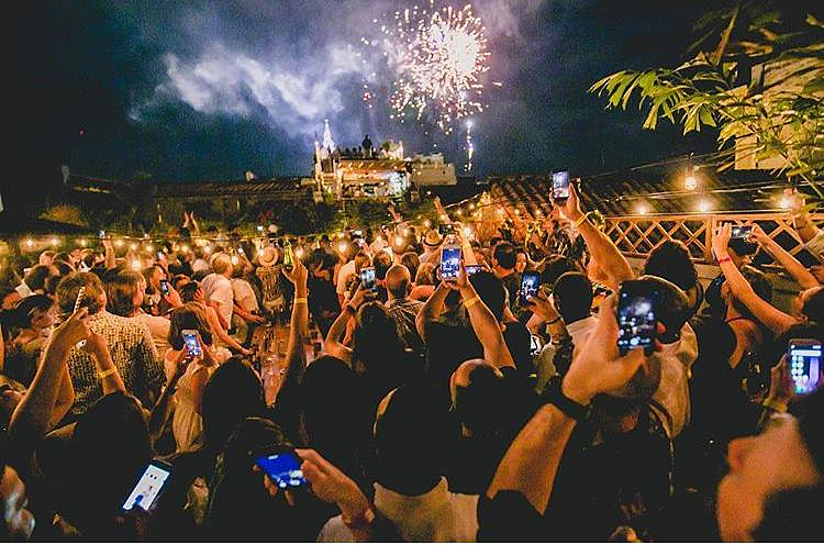 Crowd celebrating New Year with fireworks in Cartagena at night