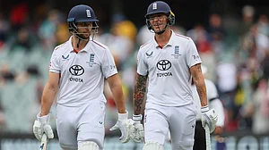 | Photo: AP/James Elsby : England's Brydon Carse, right, and Will Jacks walk from the field for the lunch break during play on the final day of the third Ashes cricket test between England and Australia in Adelaide, Australia, Sunday, Dec. 21, 2025.