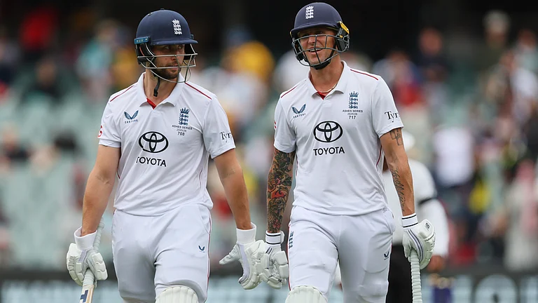 England's Brydon Carse, right, and Will Jacks walk from the field for the lunch break during play on the final day of the third Ashes cricket test between England and Australia in Adelaide, Australia, Sunday, Dec. 21, 2025. - | Photo: AP/James Elsby