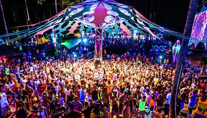 Crowded outdoor night festival under lights