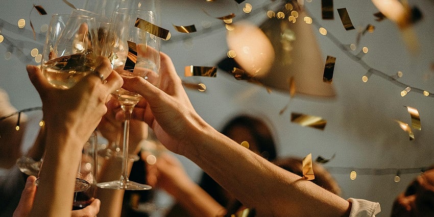 People clinking champagne glasses
