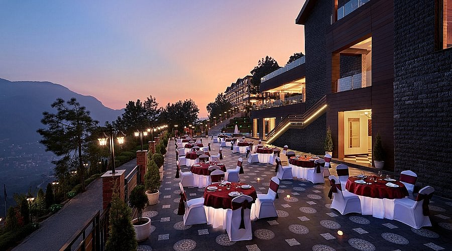 Outdoor dining terrace at Deventure Shimla Hills
