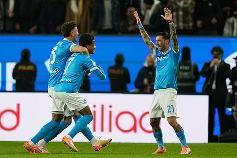 Napoli's David Neres, second form left, celebrates with teammates after scoring during the Italian Super Cup final soccer match between Napoli and Bologna in Riyadh, Saudi Arabia.