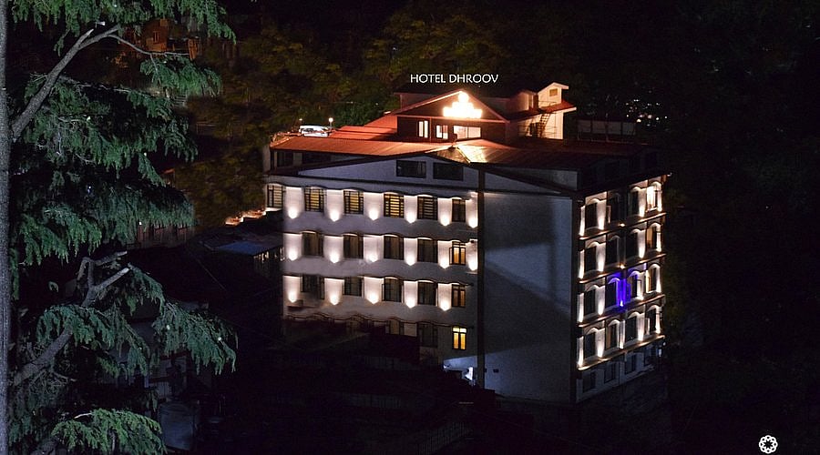 Hotel Dhroov illuminated at night