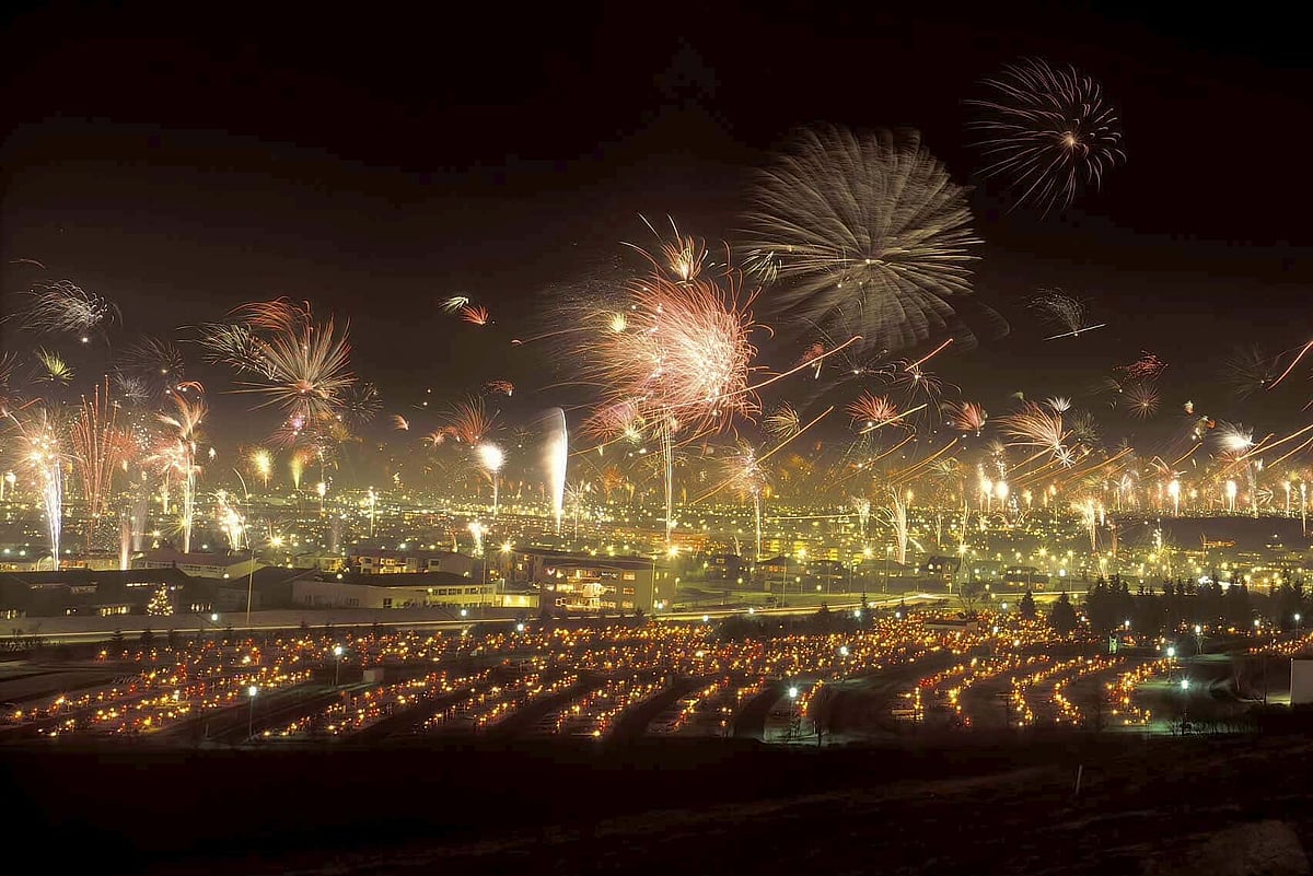 Fireworks lighting up Reykjavik cityscape during New Year celebrations