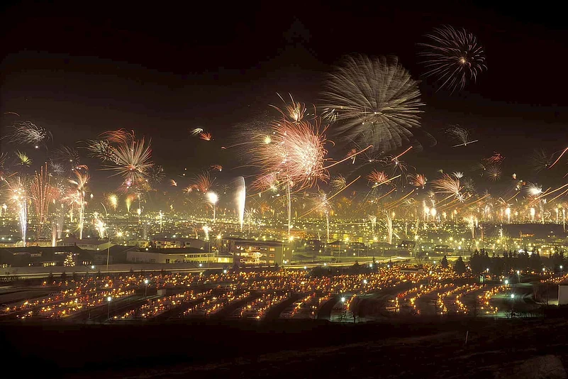 Fireworks lighting up Reykjavik cityscape during New Year celebrations