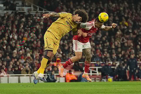 Crystal Palace's Chris Richards, left, and Arsenal's Gabriel Jesus jump for the ball during the English Football League Cup quarter-final soccer match between Arsenal and Crystal Palace in London.