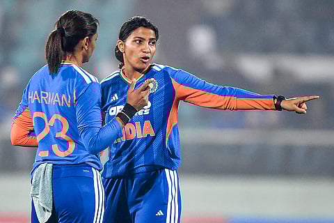 India's captain Harmanpreet Kaur with teammate Sneh Rana during the second T20I cricket match between India and Sri Lanka, in Visakhapatnam, Andhra Pradesh.