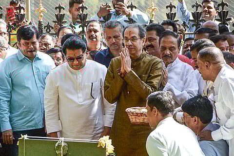 Maharashtra Navnirman Sena (MNS) chief Raj Thackeray and Shiv Sena (UBT) chief Uddhav Thackeray pay tributes at the memorial of Shiv Sena founder Bal Thackeray at Shivaji Park ahead of their alliance announcement, in Mumbai.