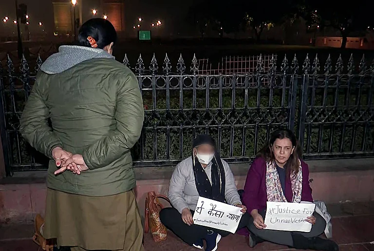 Unnao rape case victim and women activist Yogita Bhayana hold a protest against the Delhi High Court s order suspending the sentence of 2017 Unnao rape case accused, Kuldeep Singh Sengar, at India Gate in New Delhi on Tuesday. - IMAGO / ANI News
