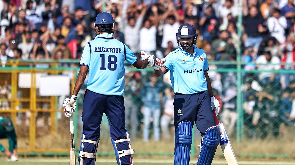 Mumbai's Rohit Sharma, right, and Angkrish Raghuvanshi greet each other during the Vijay Hazare Trophy 2025-26 cricket match between Mumbai and Sikkim, at Sawai Mansingh Stadium, in Jaipur, Wednesday, Dec. 24, 2025.  - PTI Photo/VISHAL BHATNAGAR