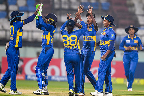 Sri Lanka's players celebrate a wicket during the second T20I cricket match between India and Sri Lanka, in Visakhapatnam, Andhra Pradesh.