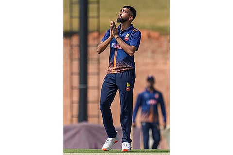 Delhi's Prince Yadav celebrates after taking a wicket during the Vijay Hazare Trophy 2025-26 cricket match between Andhra and Delhi, at BCCI Centre of Excellence Ground, in Bengaluru.
