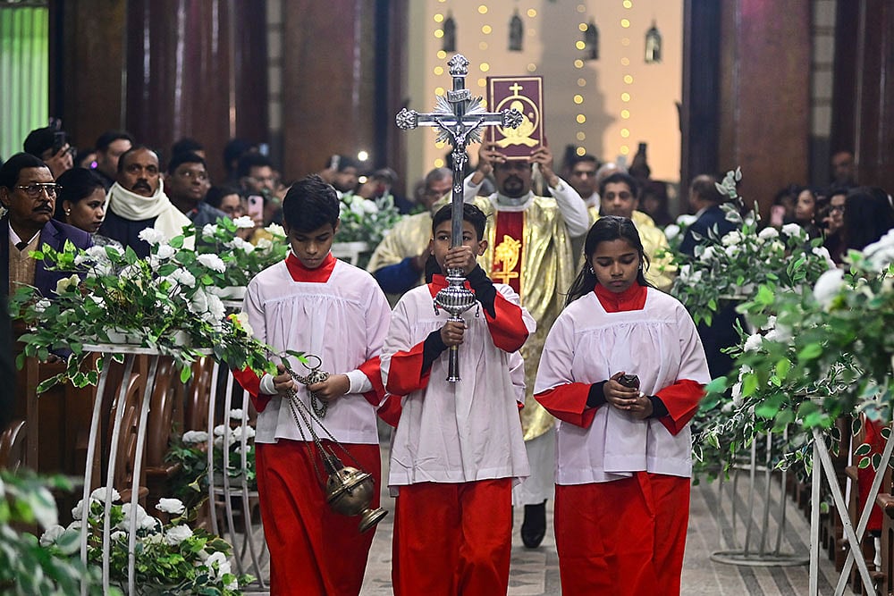 Prayagraj: People from the Christian community during the Christmas midnight mass at St. Joseph's Cathedral, in Prayagraj, Wednesday night, Dec. 24, 2025. (PTI Photo)(PTI12_25_2025_000019B) - Photo: PTI