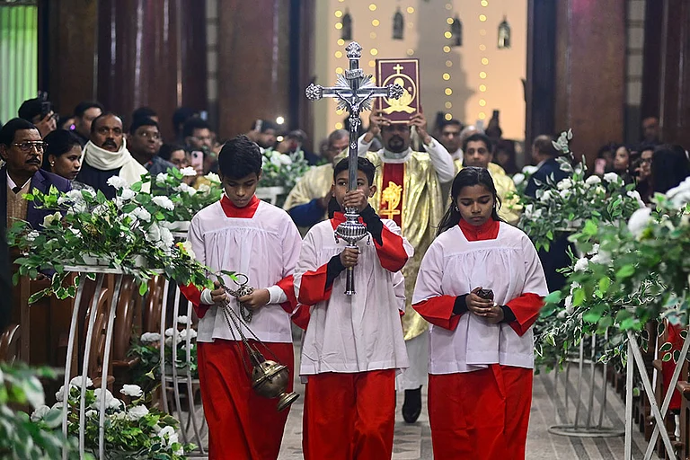Prayagraj: People from the Christian community during the Christmas midnight mass at St. Joseph's Cathedral, in Prayagraj, Wednesday night, Dec. 24, 2025. (PTI Photo)(PTI12_25_2025_000019B) - Photo: PTI