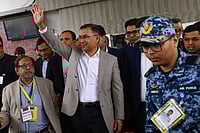 Photo: AP/Mahmud Hossain Opu : Bangladesh Nationalist Party (BNP) Acting Chairman, Tarique Rahman, waves to supporters at Hazrat Shahjalal International Airport in Dhaka after returning from London, ending more than 17 years of self-imposed exile.