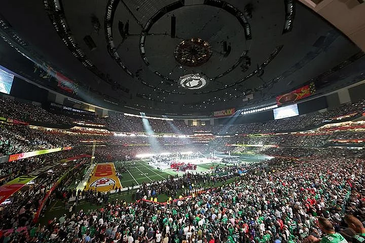 Interior of a packed Super Bowl stadium during a game or halftime show