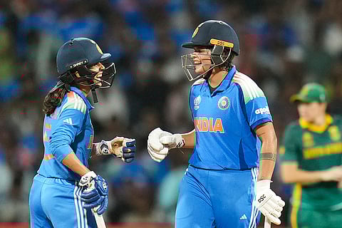 India's Shafali Verma, right, celebrates her half century with Jemimah Rodrigues during the ICC Women's World Cup final ODI cricket match between India Women and South Africa Women, at the DY Patil Stadium, in Navi Mumbai, Sunday, Nov. 2, 2025. 