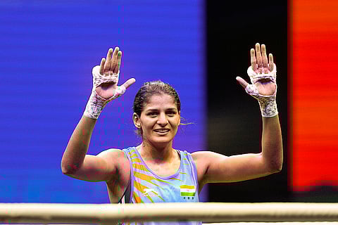 India's Jaismine Lamboria celebrates after being declared the winner in the women’s 57kg final match against Chinese Taipei's Wu Shih Yi at the World Boxing Cup Finals 2025, in Greater Noida, Uttar Pradesh, Thursday, Nov. 20, 2025. 