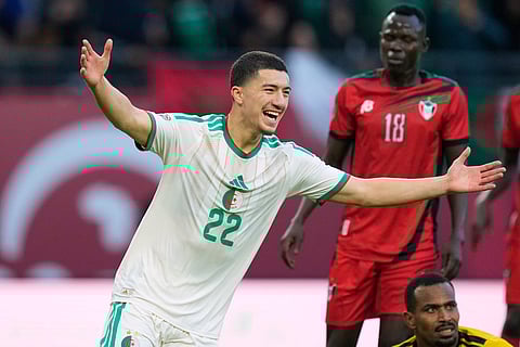 Algeria's Ibrahim Maza celebrates after scoring his side's third goal during the Africa Cup of Nations group E soccer match between Algeria and Sudan in Rabat, Morocco.