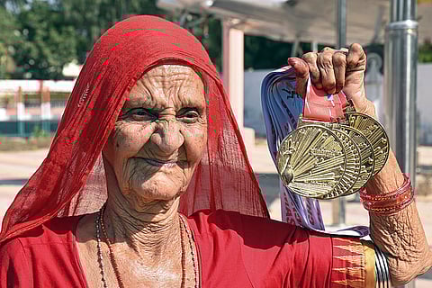94-year-old Pani Devi, who participated in the 23rd Asia Masters Athletics Championship held recently in Chennai for veteran athletes and won four gold medals, interacts with the media, in Bikaner, Wednesday, Nov. 12, 2025. 